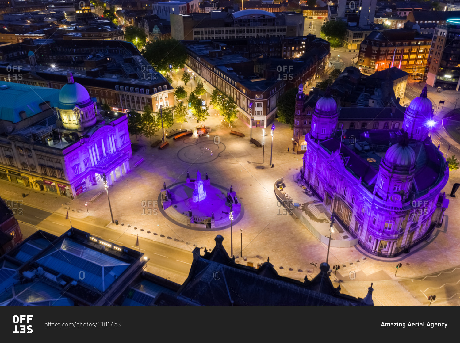 Aerial view of Queen Victoria square with purple light at night in Hull city center, United Kingdom.