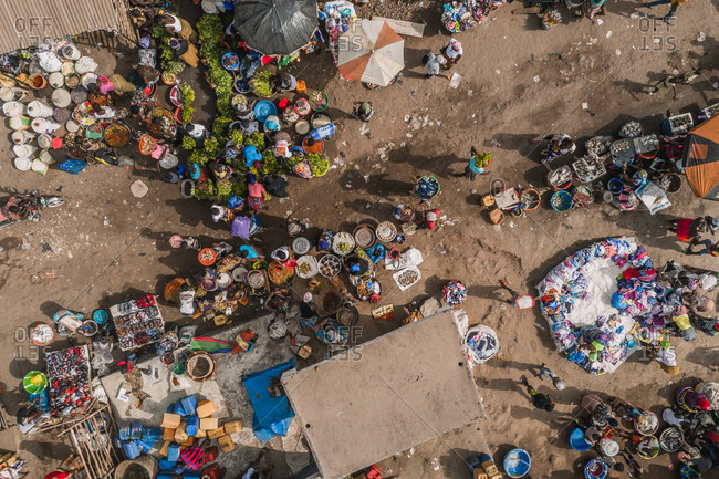 Aerial view of traditional city market with people in Tombo city, Western Area, Sierra Leone.