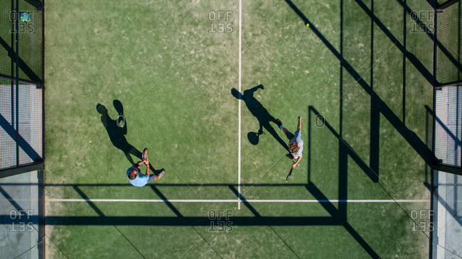Aerial view of two people playing paddle in a tennis court at Papalus Golf club, Catalonia, Spain.