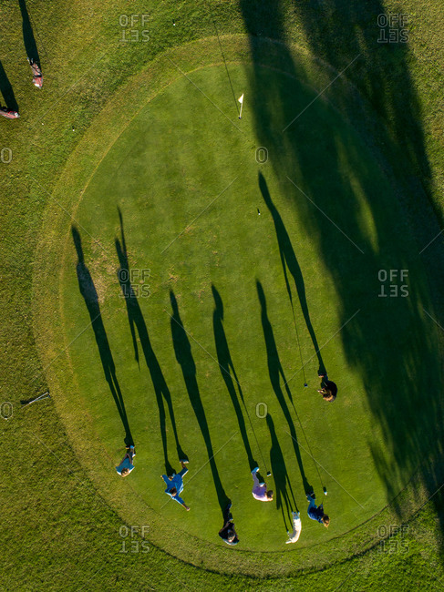 Aerial view of a group of people playing Golf in Lloret de Mar golf club, Catalonia, Spain.