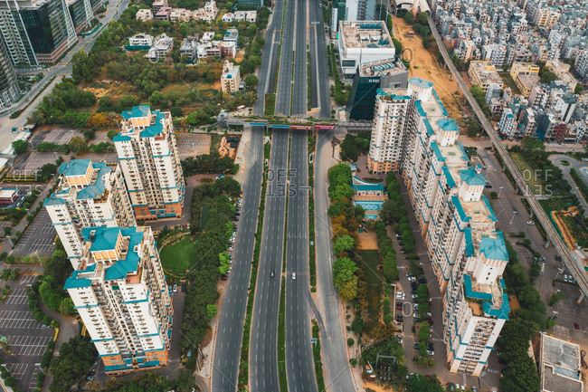 Aerial view of Gurugram residential district with barracs and an empty suspended highway near the city of New Delhi in Haryana state during lockdown, India.