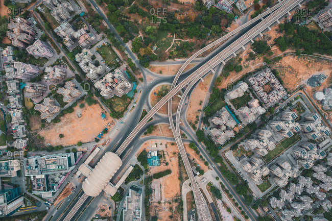 Aerial view of Gurugram district with buildings and an empty suspended highway near the city of New Delhi in Haryana state during lockdown, India.
