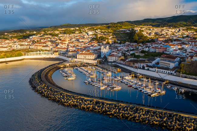 Aerial view of the Saint Mateus fishing harbor at sunset on Terceira Island. Azores archipelagos, Portugal.