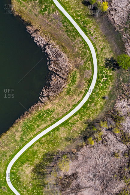 Aerial view of a winding path in a forest preserve in Lisle, IL, United States.