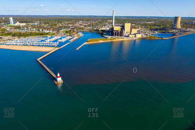 Aerial view of Michigan city East Pierhead lighthouse and the electric power plants in Chicago, Illinois, United States of America.