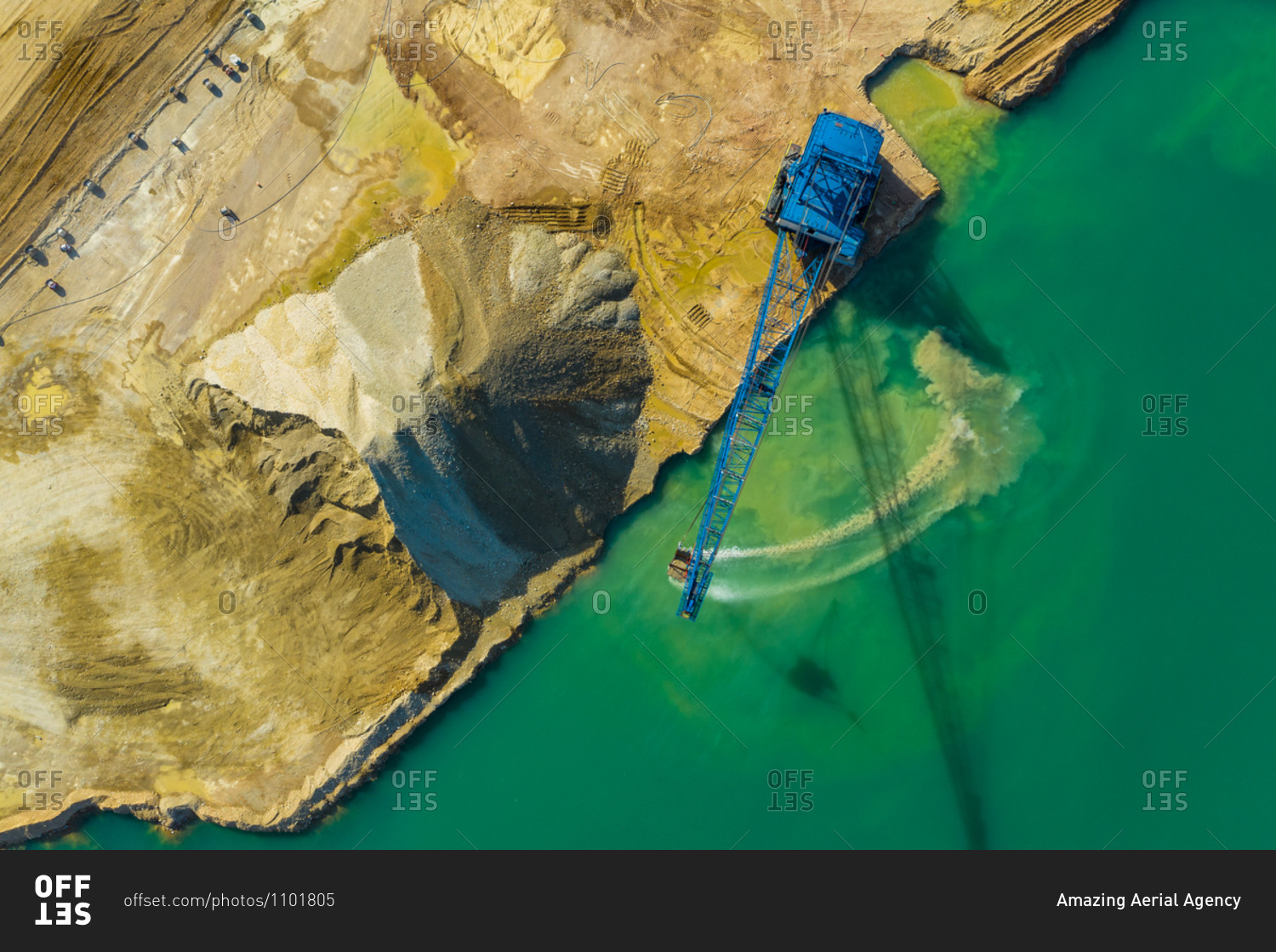 Aerial view of a blue crane operating on a quarry in Blackberry Township in Illinois, United States of America.