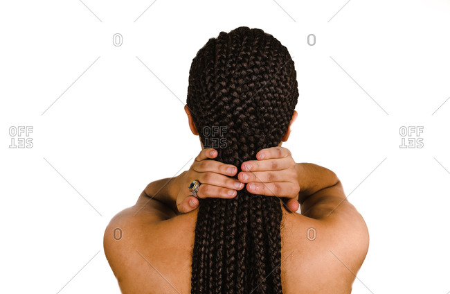 A back shot of a woman showing off her braided hairstyle