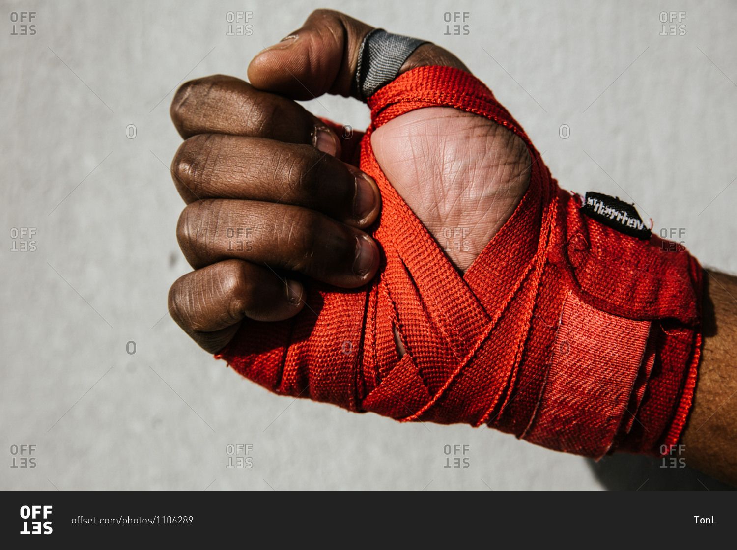 Close up shot of a hand wrapped in boxing wraps