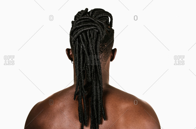 A back shot of a black man with dreadlocks hairstyle