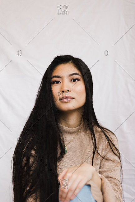 Portrait of a beautiful woman with long dark black hair