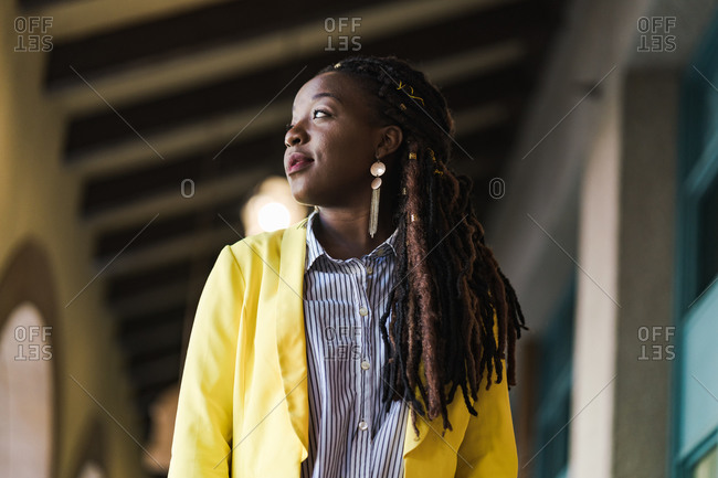 Wide close up shot of a young stylish girl with long braids