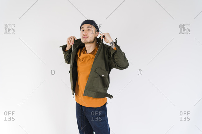 Young Man Fixing His Hair In A Fashion Pose In Studio Stock Photo, Picture  and Royalty Free Image. Image 28217283.