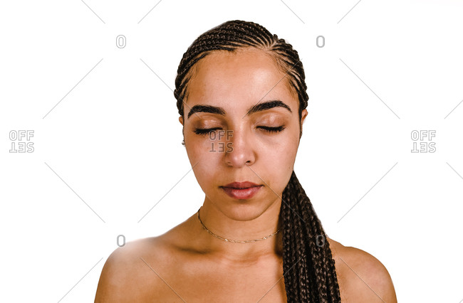 Back view of woman's brown hair tied in a ponytail stock photo - OFFSET
