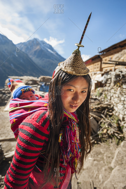 A Layap woman from the village of Laya wearing a tradition hat which features a unique spike made from bamboo