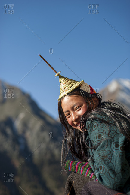 A Layap girl smiles for the camera in the remote village of Laya