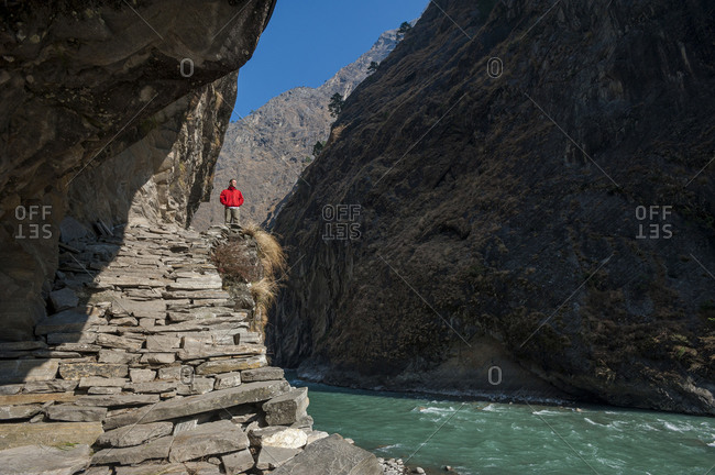 Standing beside the Buri Gandaki river in the Manaslu region