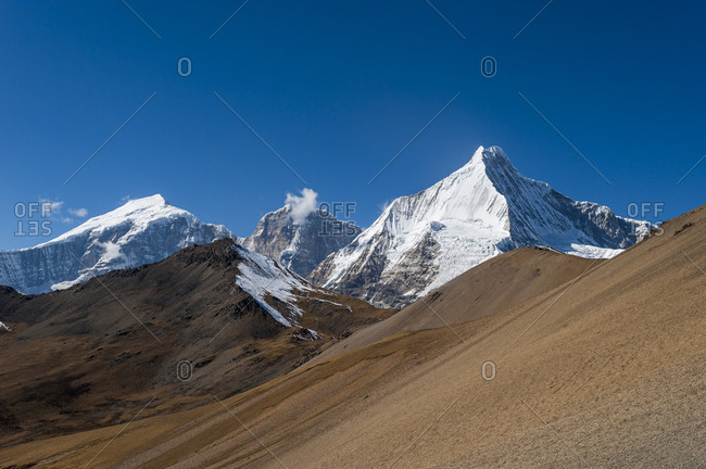 The white pyramid shape of Jichu Drake is 6662m high seen from the 4950m high Nyile La pass in Bhutan