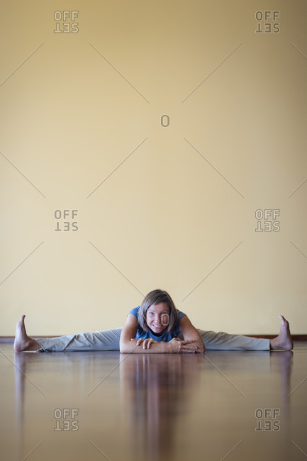 A woman does the splits in a Yoga studio in Kathmandu