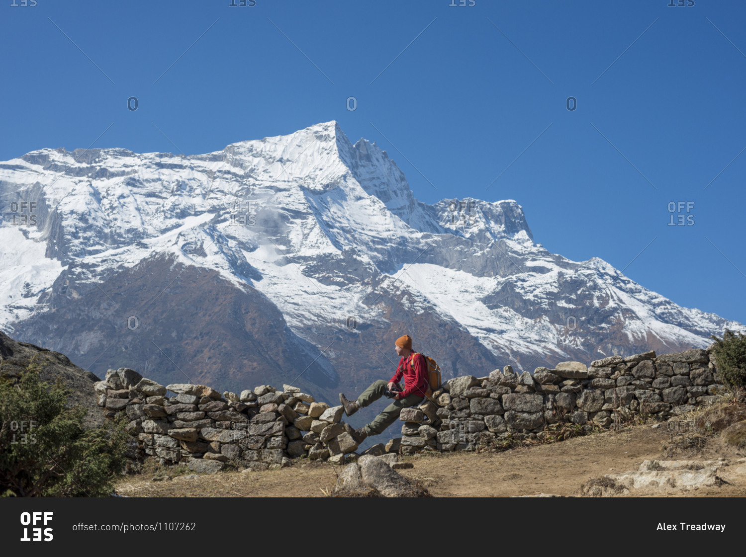 Taking a break from the trail above Namche with views of Kongde peak in the Everest region of Nepal