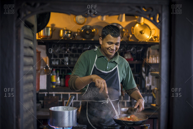 A Nepali chef prepares Dal Bhat which is a typical dish in Nepal