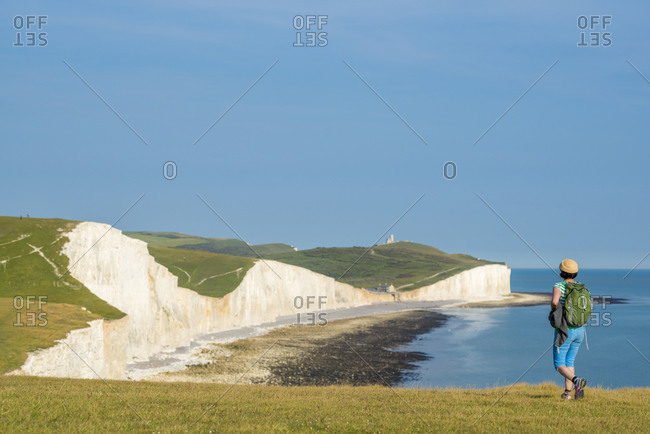 Walking along the South Downs Way with views of the cliffs nears Beachy Head