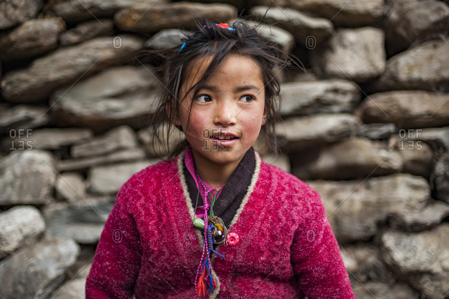 A Tibetan girl in the extremely remote Tsum valley in the Manaslu region of the Nepal Himalayas