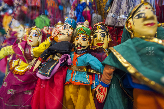Colorful puppets hanging in a shop in Udaipur