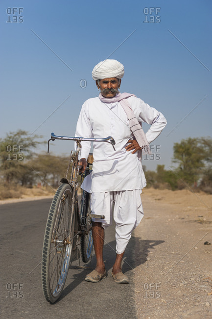 A Rajasthani man in typical dress with his bicycle