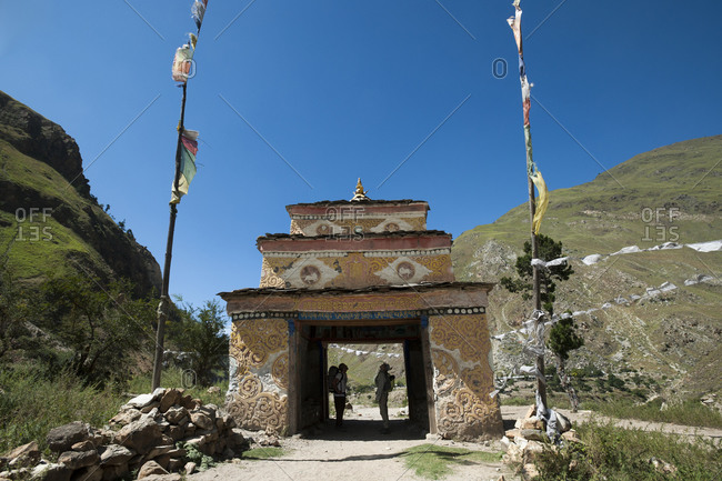 Hikers stop to admire the murals inside a Tibetan Kani in Dolpa a remote region of Nepal