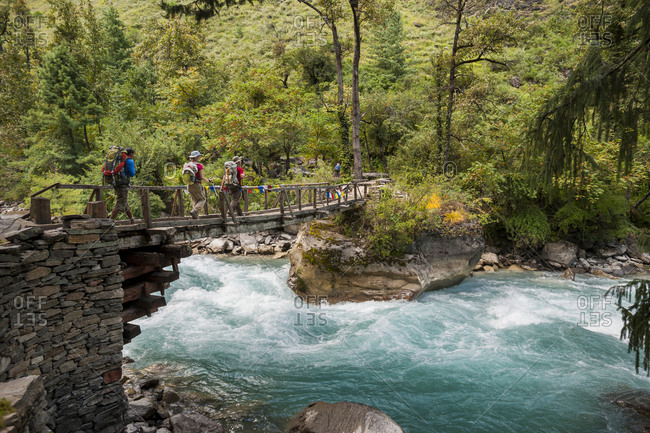 Hikers cross a bridge in Dolpa, a remote region of Nepal