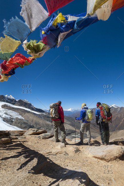 Trekkers looking out from the top of the Kagmara La in Dolpa, a remote region of Nepal