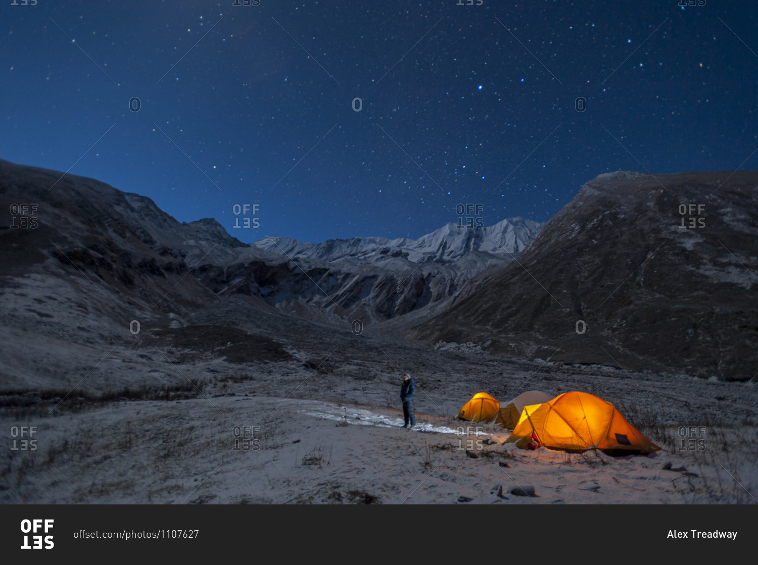 In the little explored Juphal valley in the remote Dolpa region of Nepal, a man stands outside his tent on a cold night to look at the stars