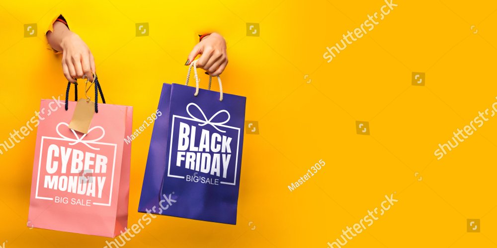 Hands holding gift boxes with black friday lettering on yellow background. Concept of sales, black friday, cyber monday, finance, business, money. Online shops and payments bill. Copyspace for ad.