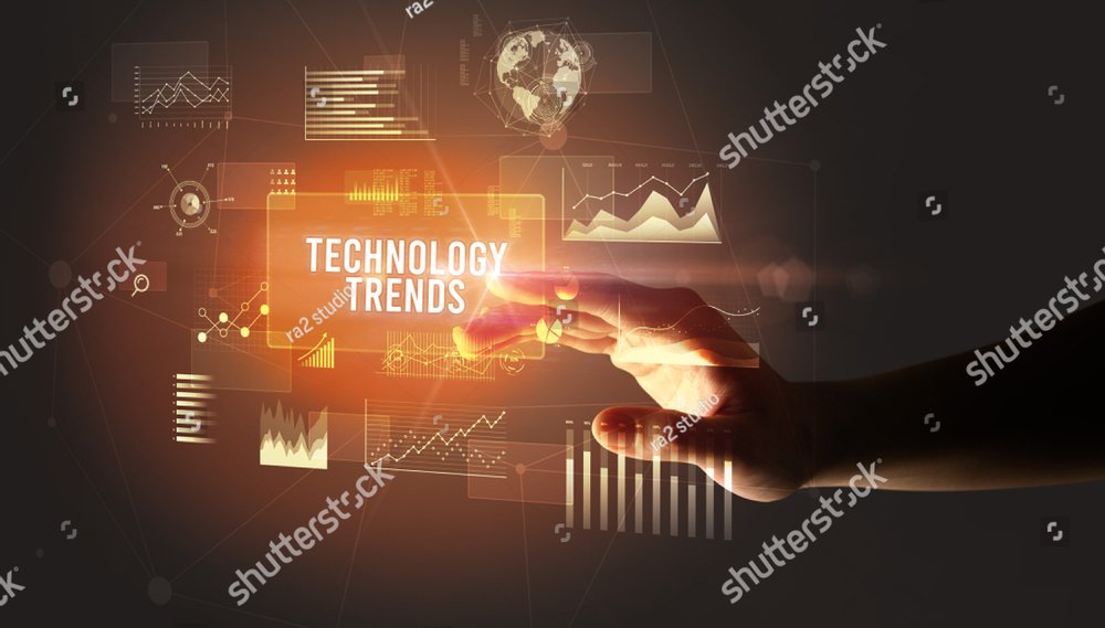 Hand touching TECHNOLOGY TRENDS inscription, new business technology concept