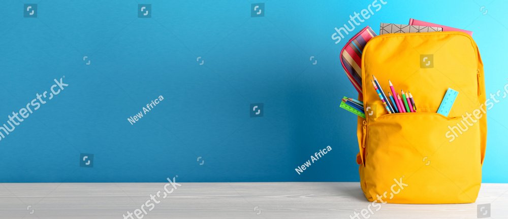 Backpack with different colorful stationery on table. Banner design
