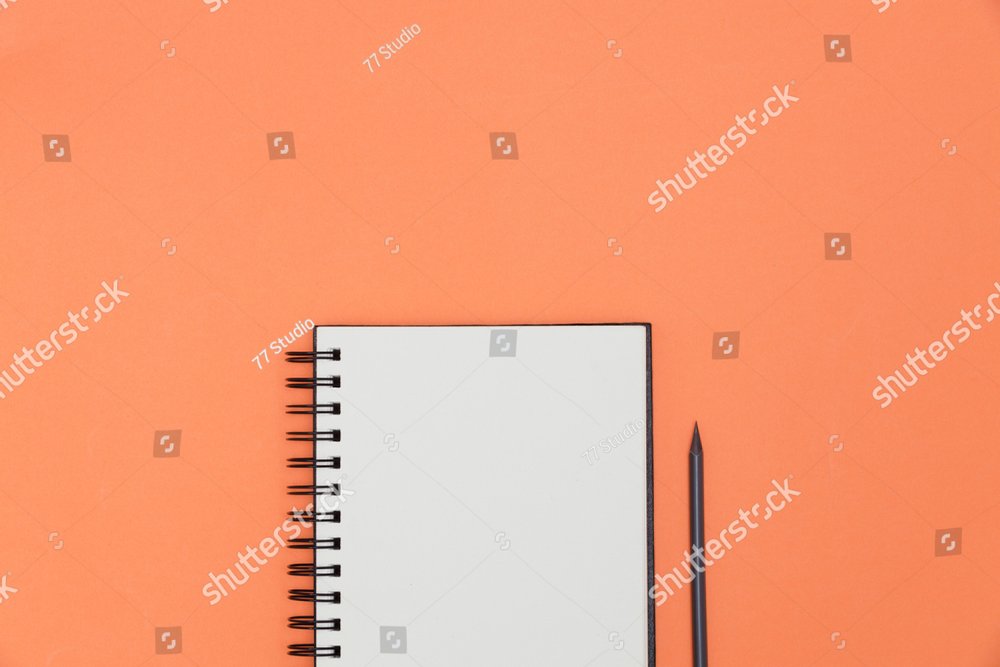 Blank spiral notebook and pencil on orange background. Top view with copy  space for input the text. Business Images