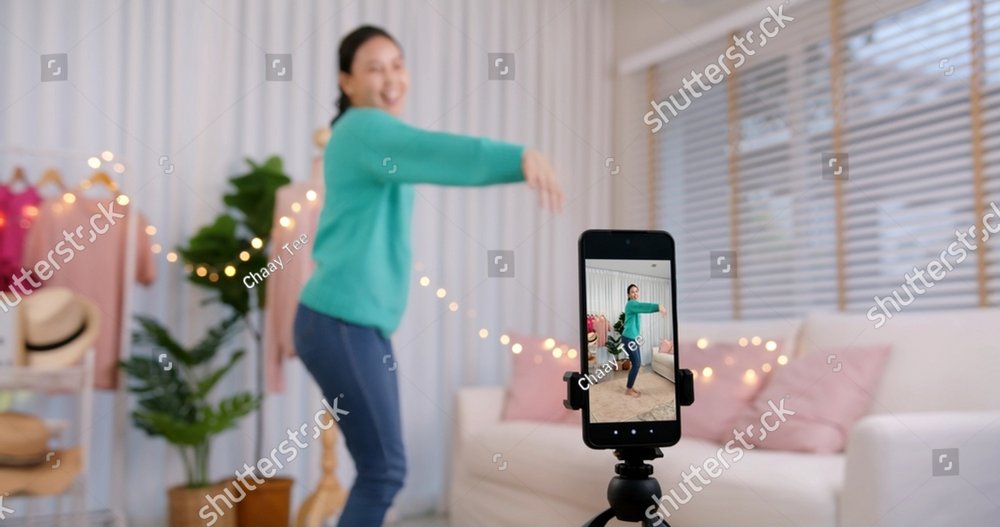 Asia vlogger woman influencer smile enjoy hobby happy fun live online screen SME retail store in IG reel tiktok at home. Gen Z talent people play video selfie shoot app for show share viral story.