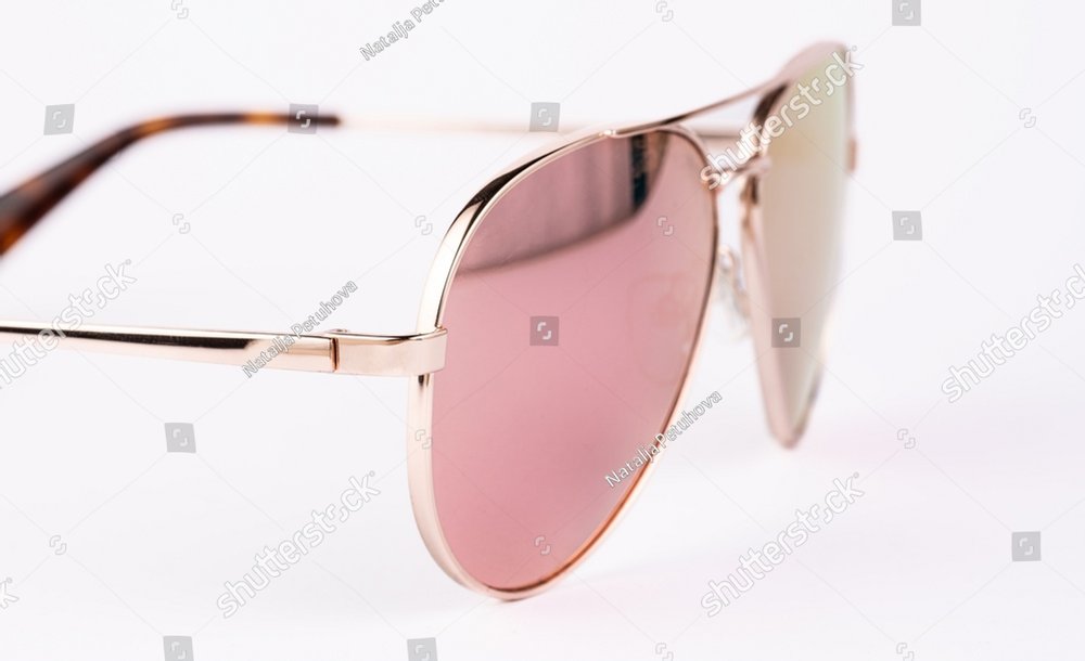 Aviator sunglasses gold frame with multicolor green mirror lens isolated on white background with clipping path. glasses