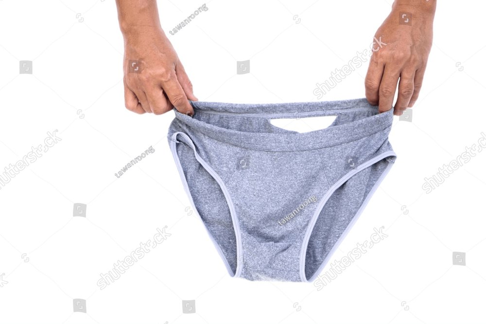 Man's hand hold old and torn underwear pants from long time wearing ...
