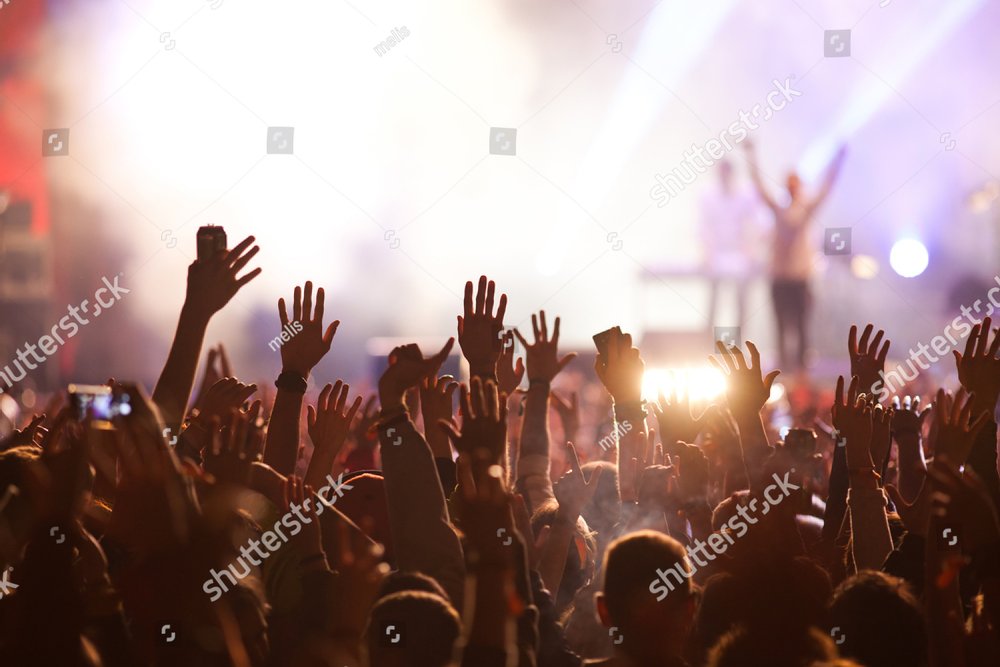 Crowd at concert and blurred stage lights