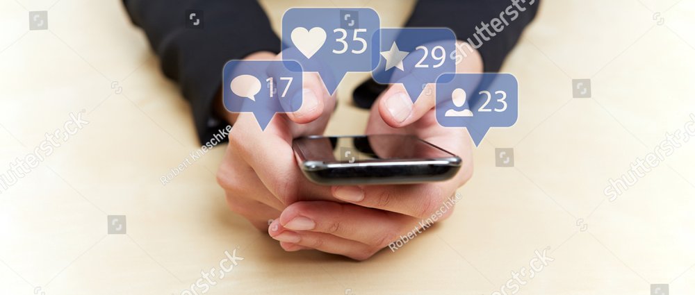 Hands holding smartphone with social media or social network notification icons