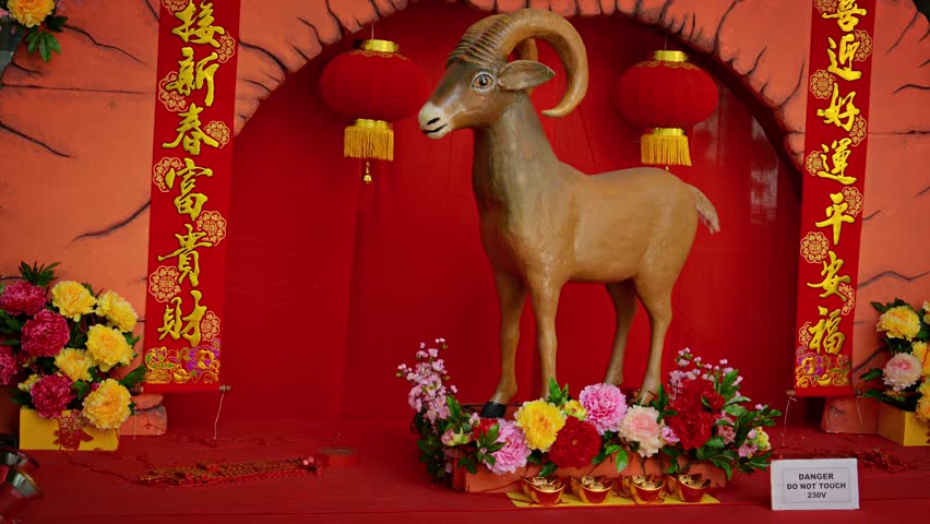 HONG KONG. CHINA - CIRCA JAN 2014: Slow panning shot of a goat statue. from the Chinese zodiak. displayed as a Chinese New Year decoration. | Shutterstock HD Video #10006769