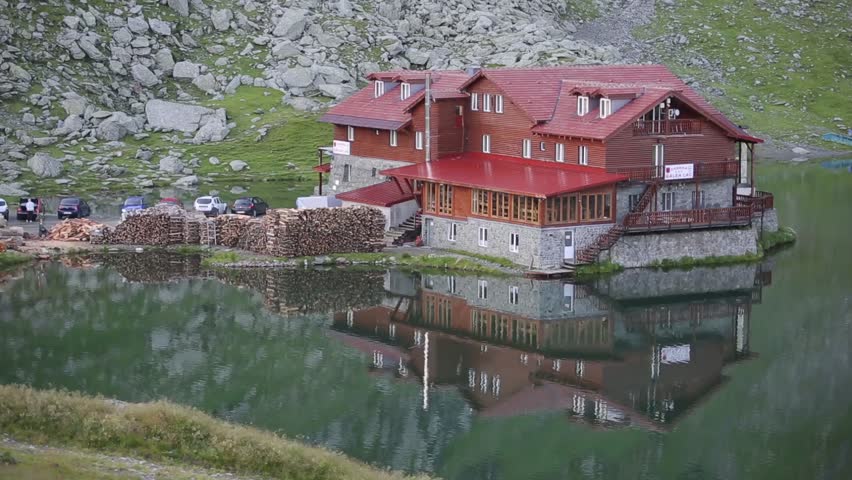 House on the lake perfectly reflecting on the water.