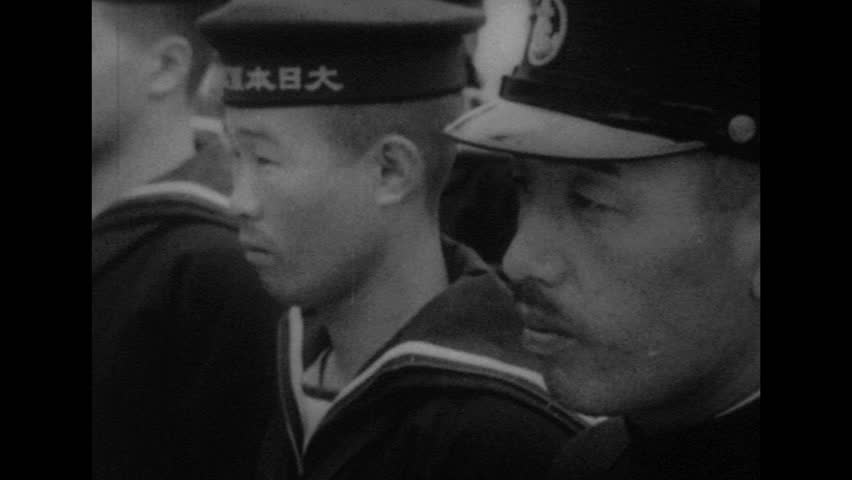 UNITED STATES 1940s: Montage of views of Japanese soldiers / Close up of Japanese soldier superimposed over soldiers marching.