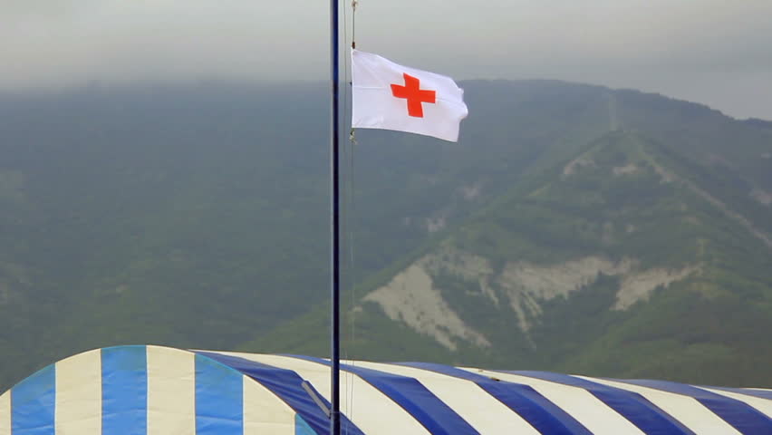 Red cross flag on mountain camp