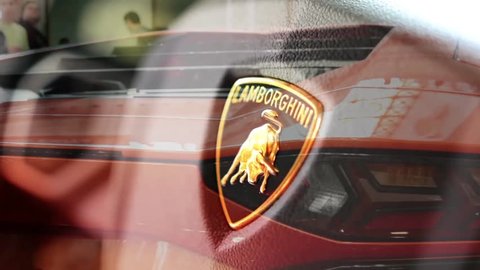PRAGUE, CZECH REPUBLIC, CAR EXHIBITION - SEPTEMBER 27, 2014: detail of logo (wheel) - Lamborghini (interior) - backlight and side of car (mirror)- luxury fast car - Lamborghini - Aventador