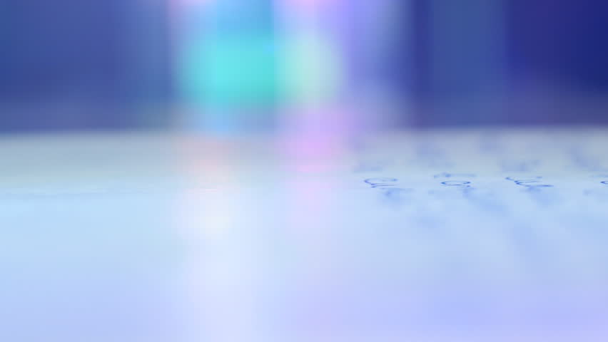 Pen writes a letter on paper. Extreme closeup. Shallow depth of field