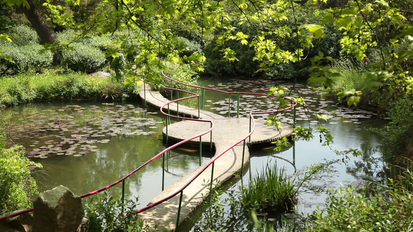 Pond With A Bridge In The Spring Park, Rainy