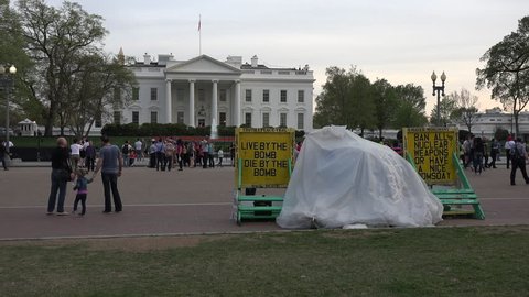 WASHINGTON DC - APR 2015:Washington DC White House anti war peace demonstrator. Freedom of speech allows demonstrators protestors to occupy public property. Protected by United States Secret Service.