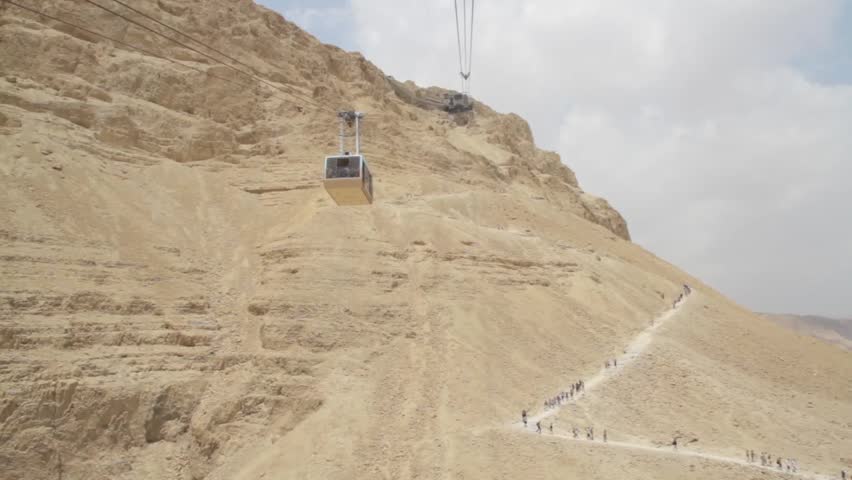 Masada Cableway. Cable car way to canyon and over the tourists.
